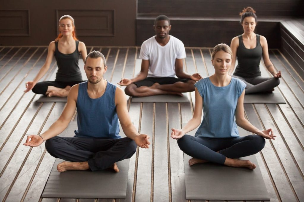 Group young yogi people sitting sukhasana exercise 1.jpg