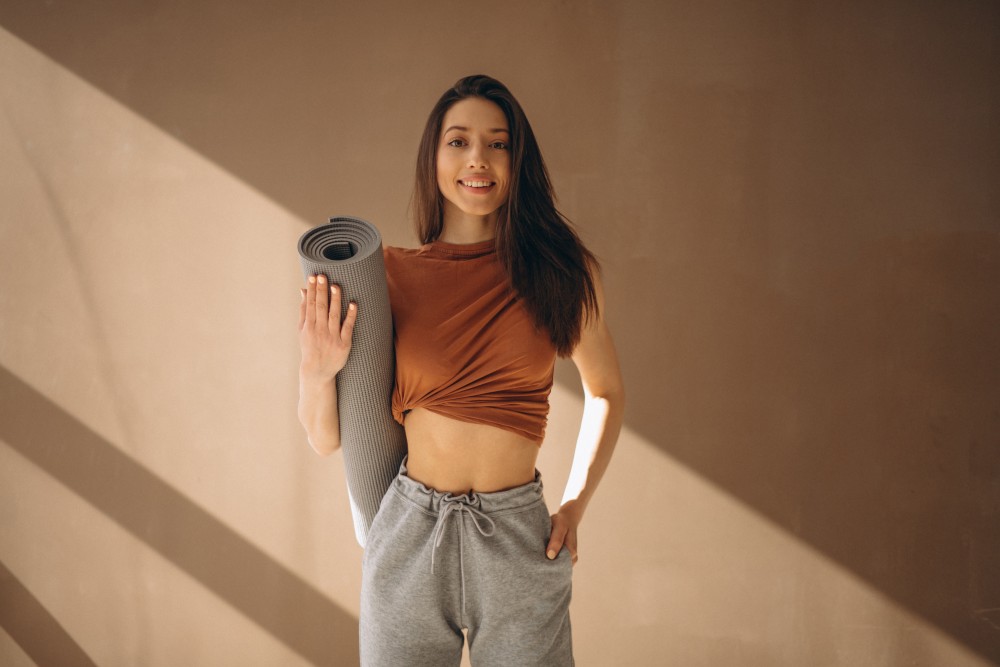 Woman with yoga mat 2 1.jpg